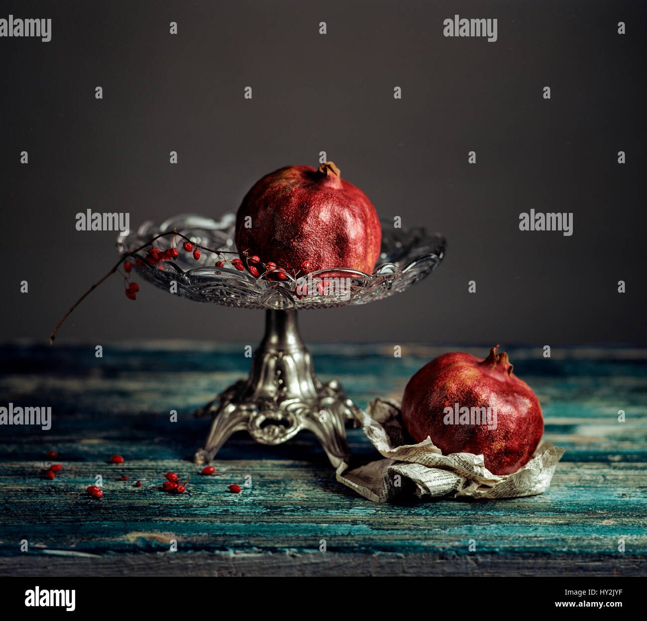 Still Life with Pomegranate on antique glass bowl Stock Photo