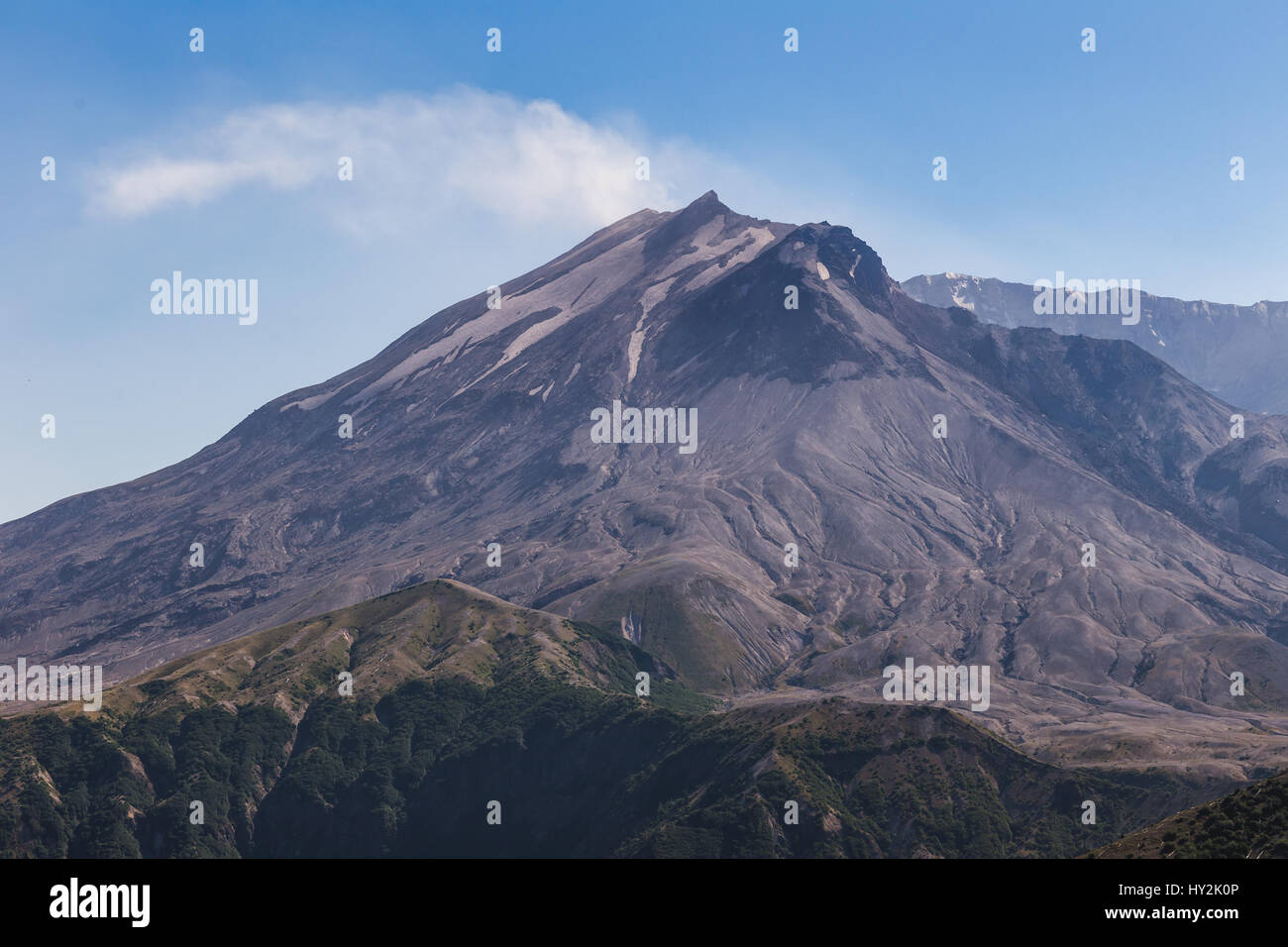 Mount St. Helens with Smoke Billowing. Sunny summer day under blue sky. Stock Photo
