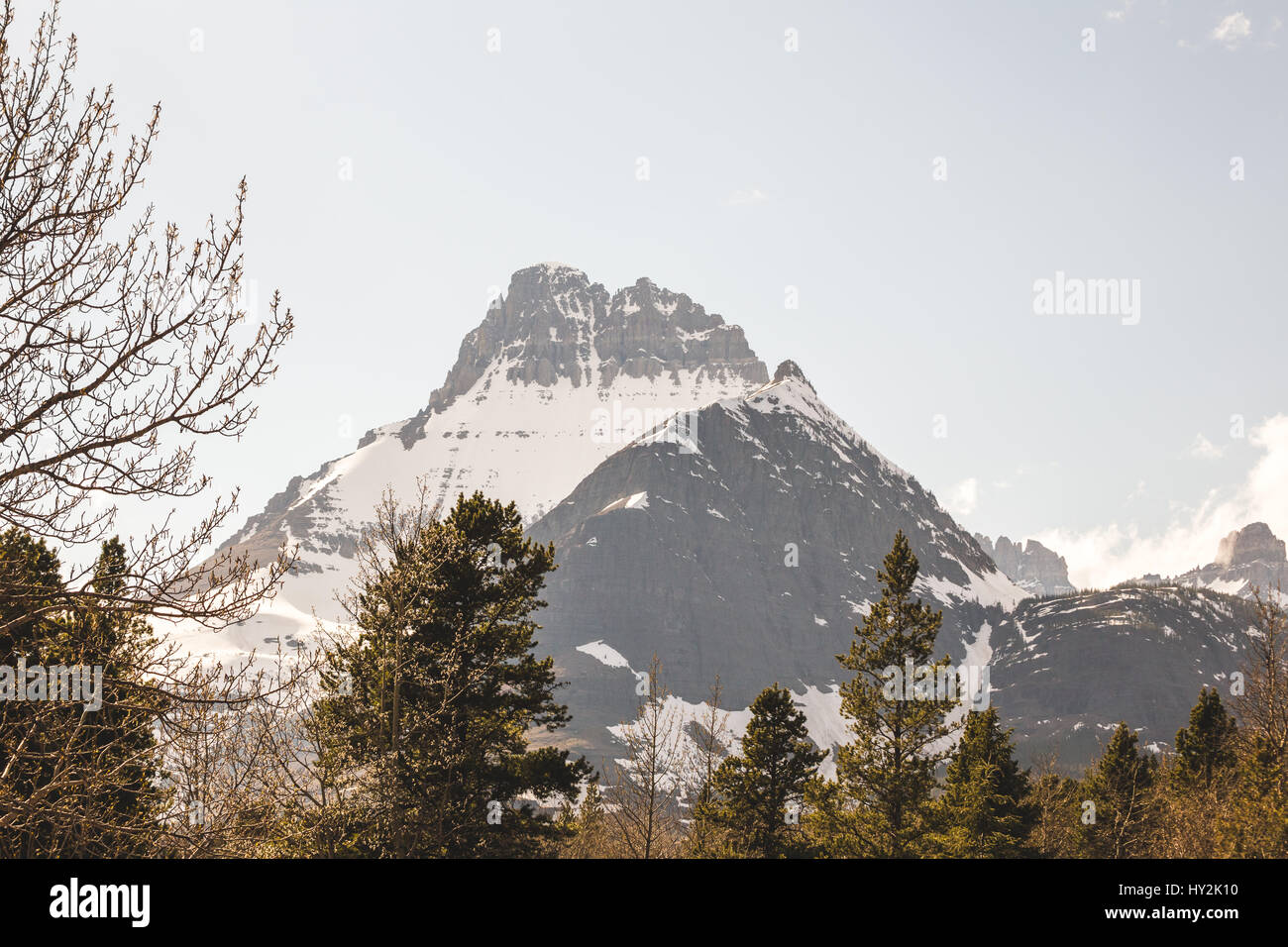 Snowy mountain peaks at Glacier National Park in Montana, USA. Sunny day with blue sky. Stock Photo