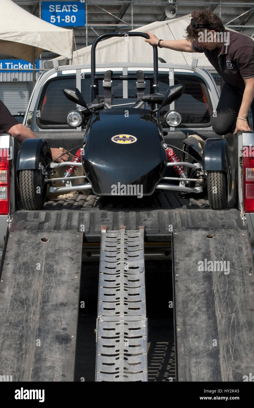 Santa Pod, UK - April 23, 2010: Alternative energy racing at Santa Pod Raceway. Battmobile electric trike being unloaded before racing. Stock Photo