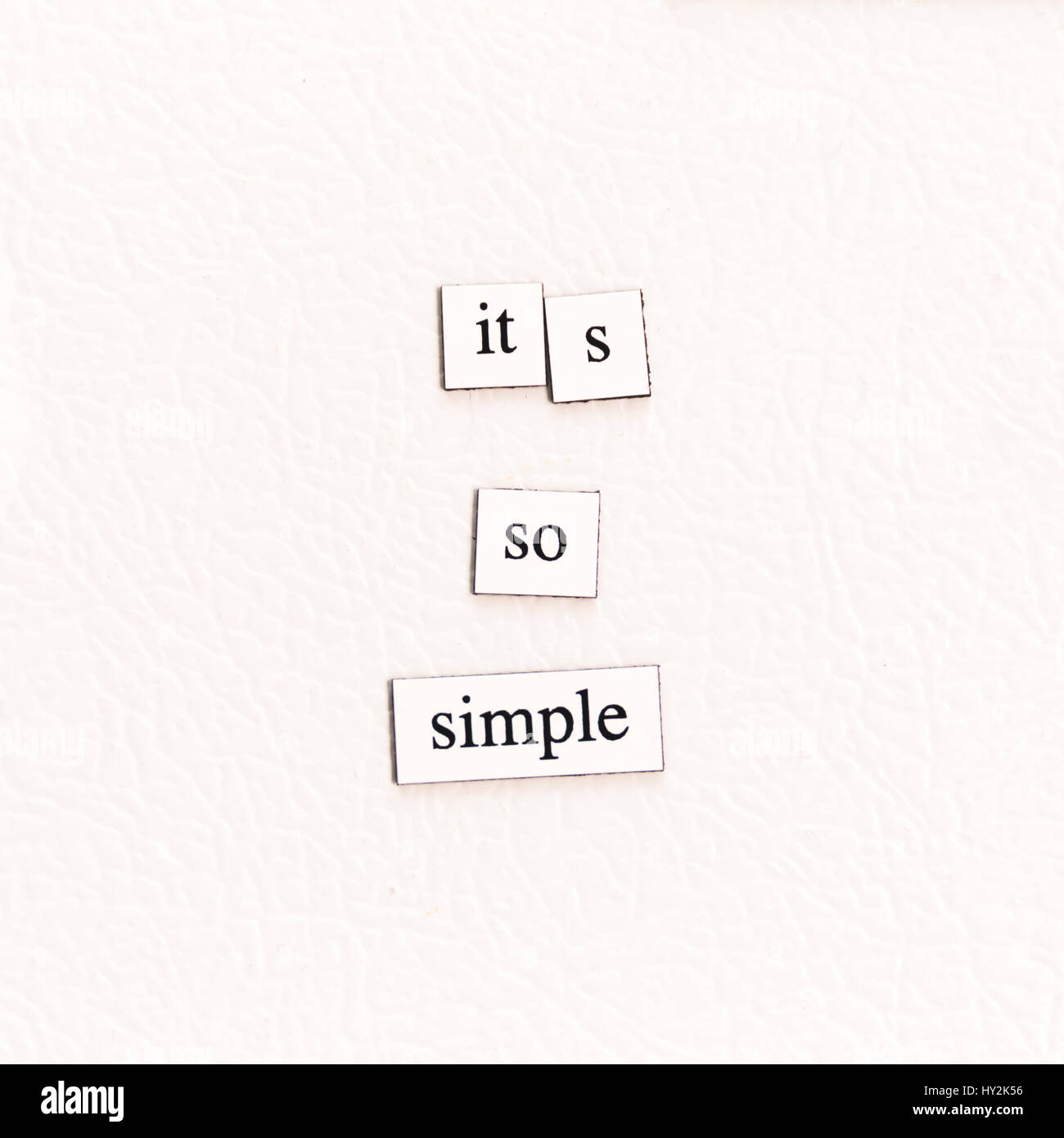 Magnets on a refrigerator stating 'it's so simple.' Stock Photo
