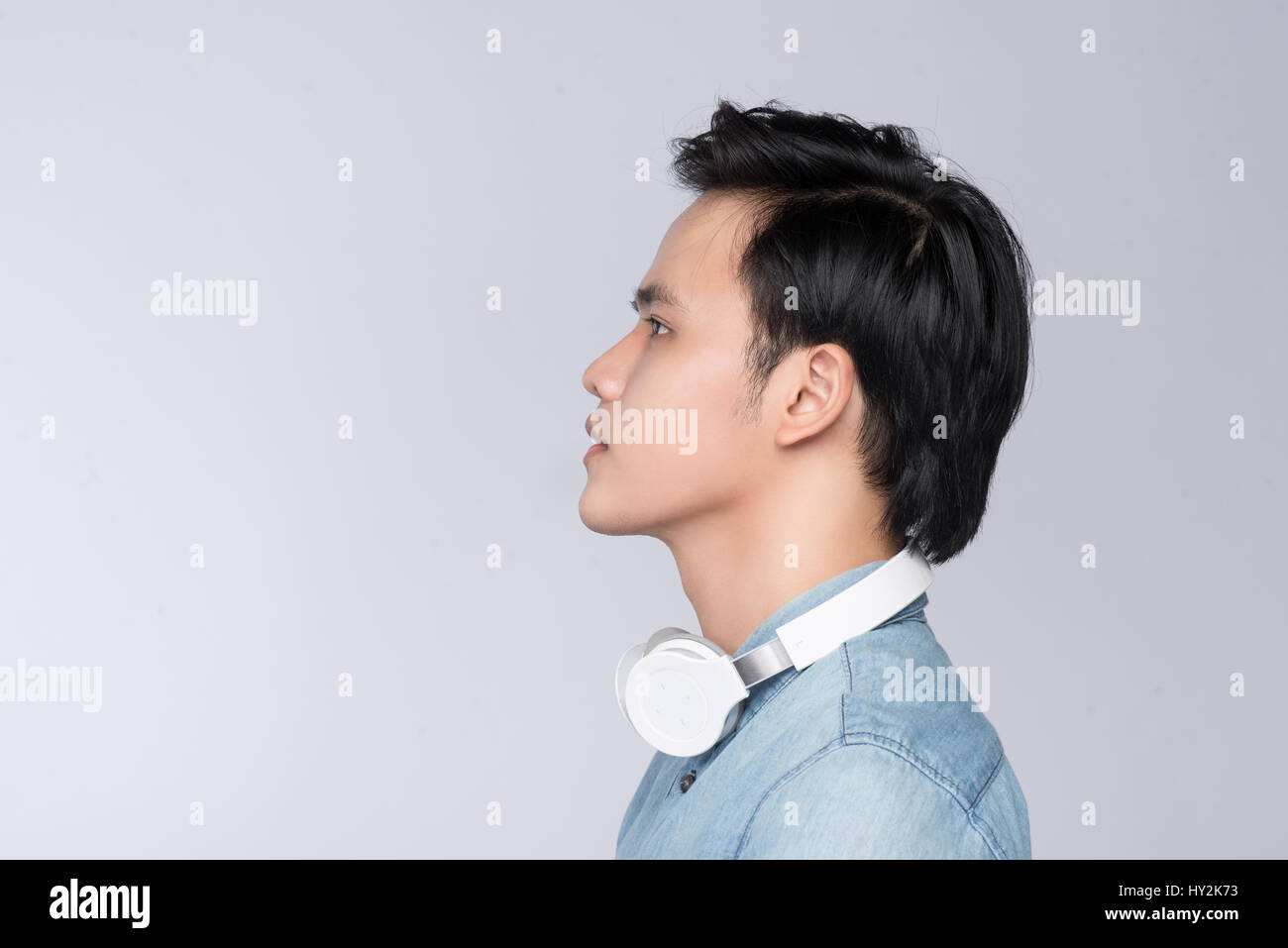 Smart casual asian man with headphone in studio background Stock Photo