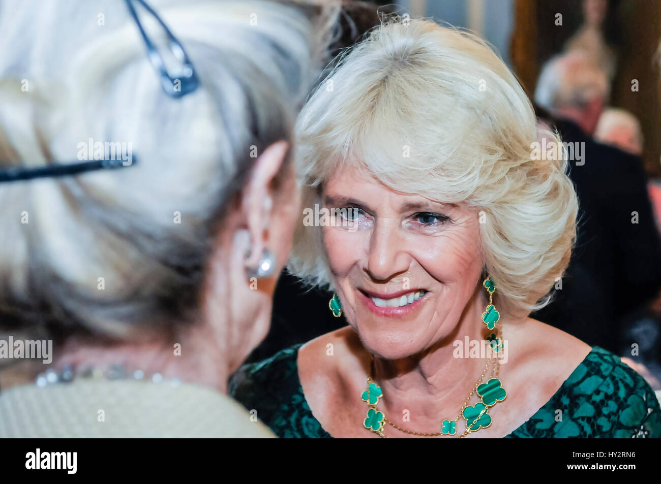 HILLSBOROUGH, NORTHERN IRELAND. 24 MAY 2016: The Duchess of Cornwall chats to a guest in Hillsborough Palace. Stock Photo