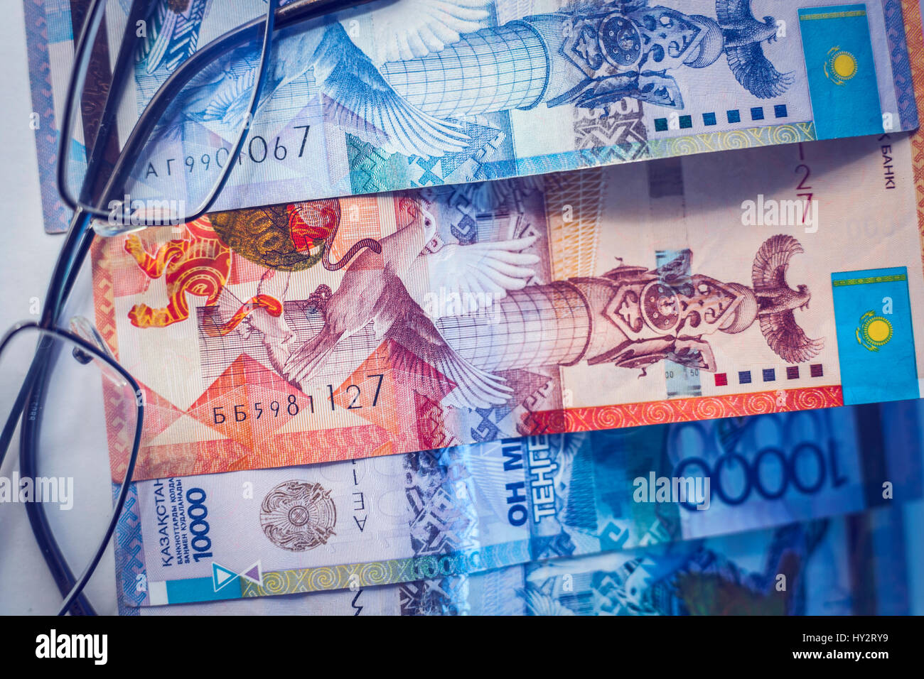 Tenge, Kazakh money and glasses. Kazakhstan National Currency Stock Photo