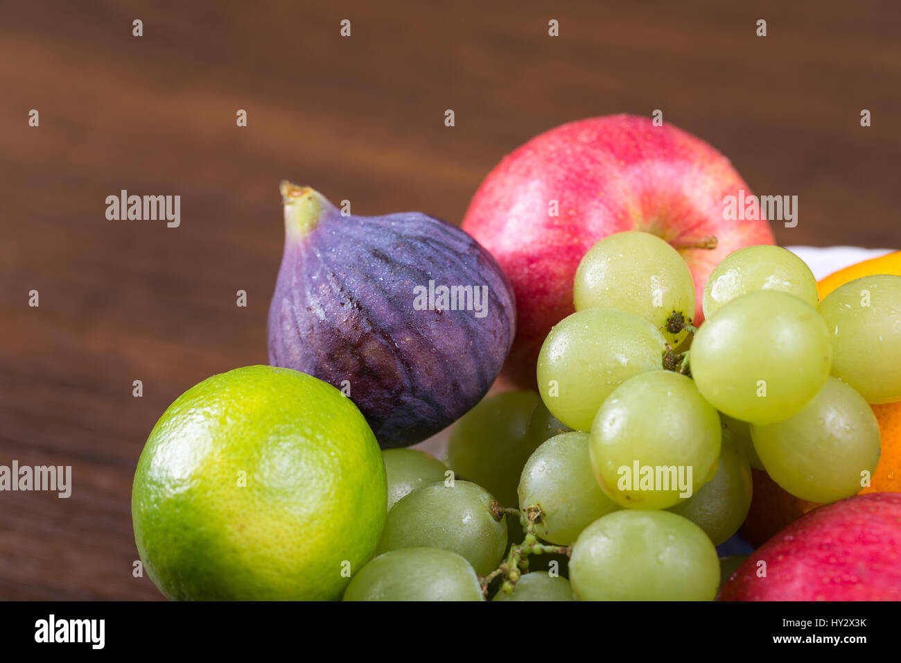 Assortment fruits on wooden table Stock Photo - Alamy
