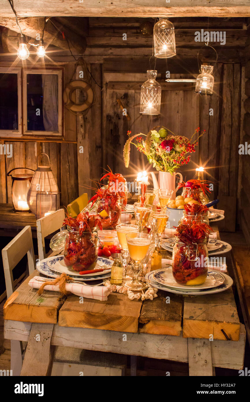 Sweden, Fresh crayfish on wooden table Stock Photo