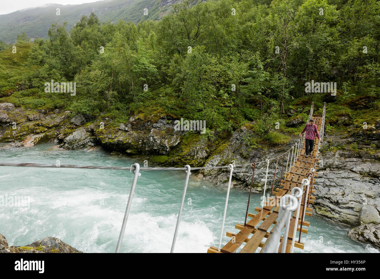 Man walking over bridge hi-res stock photography and images - Alamy
