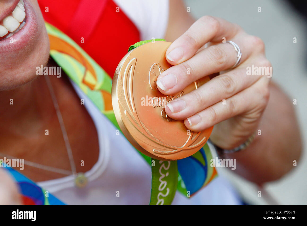 Sport, Olympics, Athlete holding gold medal from Rio games 2016. Stock Photo