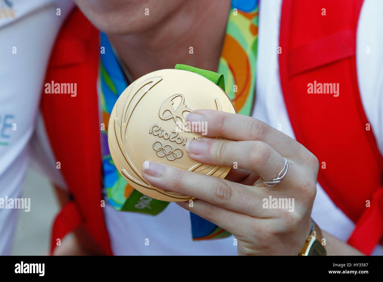 Sport, Olympics, Athlete holding gold medal from Rio games 2016. Stock Photo