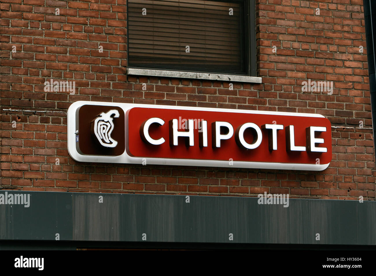 New York, December 08: Sign above one of the Chipotle mexican fast food restaurants in Manhattan. Stock Photo