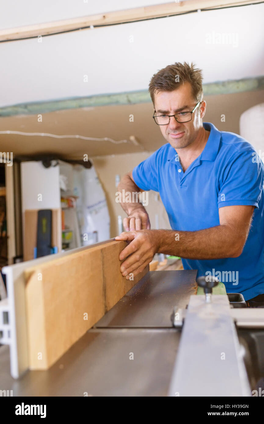 Sweden, Carpenter working with concentration Stock Photo - Alamy
