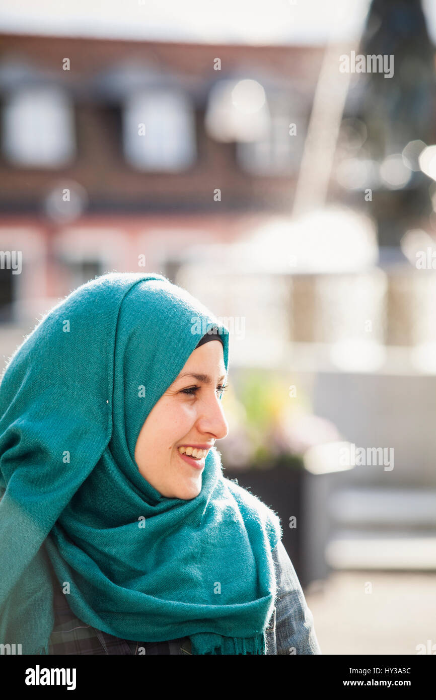 Sweden, Bleking, Solvesborg, Portrait of woman wearing headscarf Stock Photo