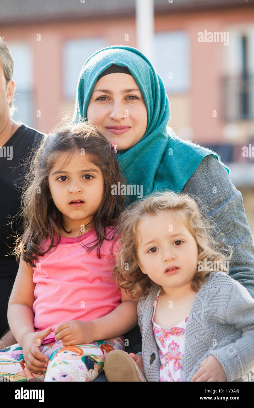 Sweden, Blekinge, Solvesborg, Portrait of mother with two daughters (2-3, 4-5) Stock Photo