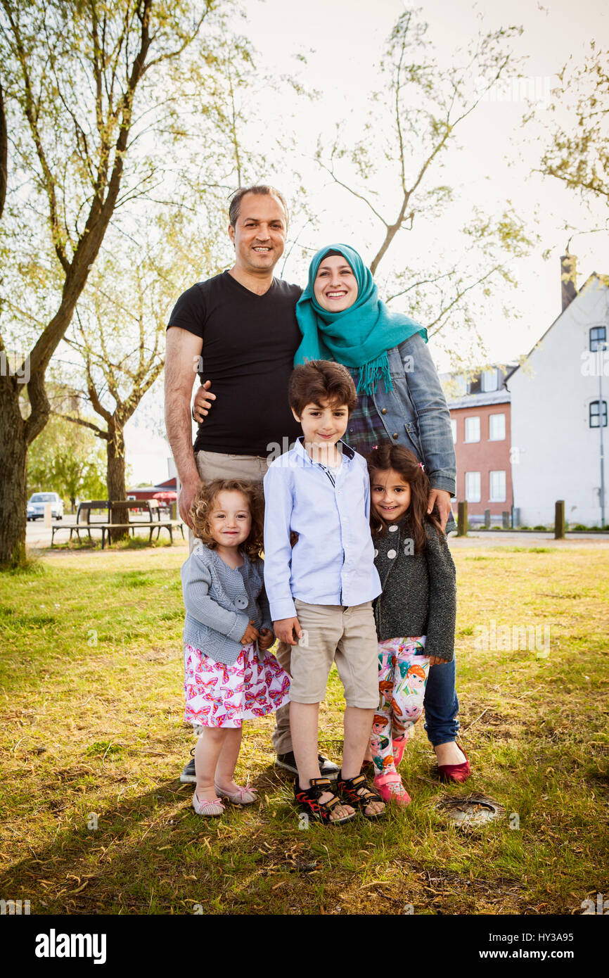 Sweden, Blekinge, Solvesborg, Family posing in park Stock Photo