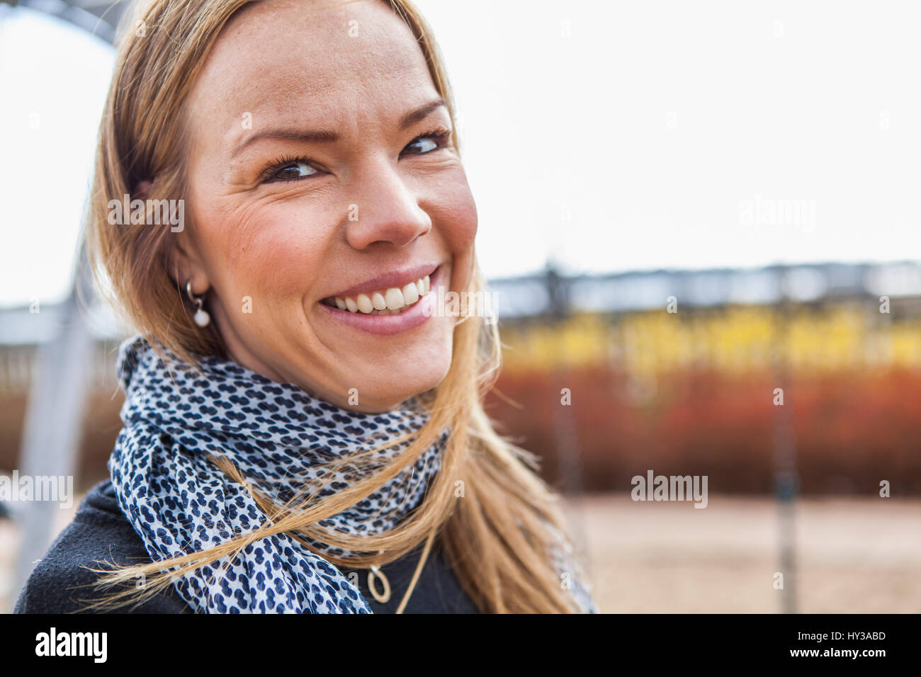 Sweden, Blekinge, Solvesborg, Portrait of smiling mid adult woman Stock Photo