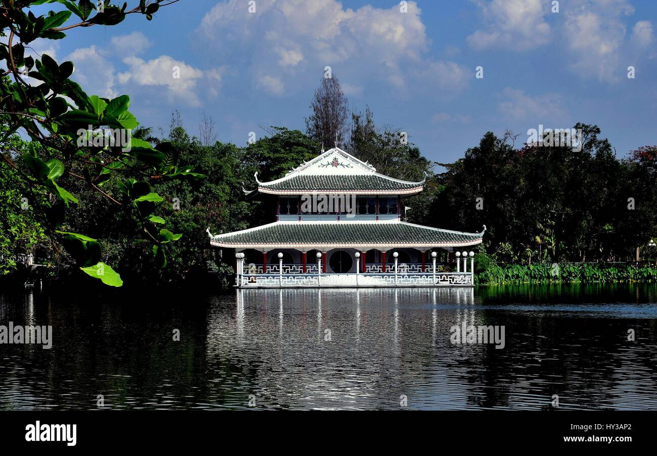 Sampan, Thailand - January 10, 2010:  View across lake to the Chinese pavilion at the Riverside Rose Garden and Park Stock Photo