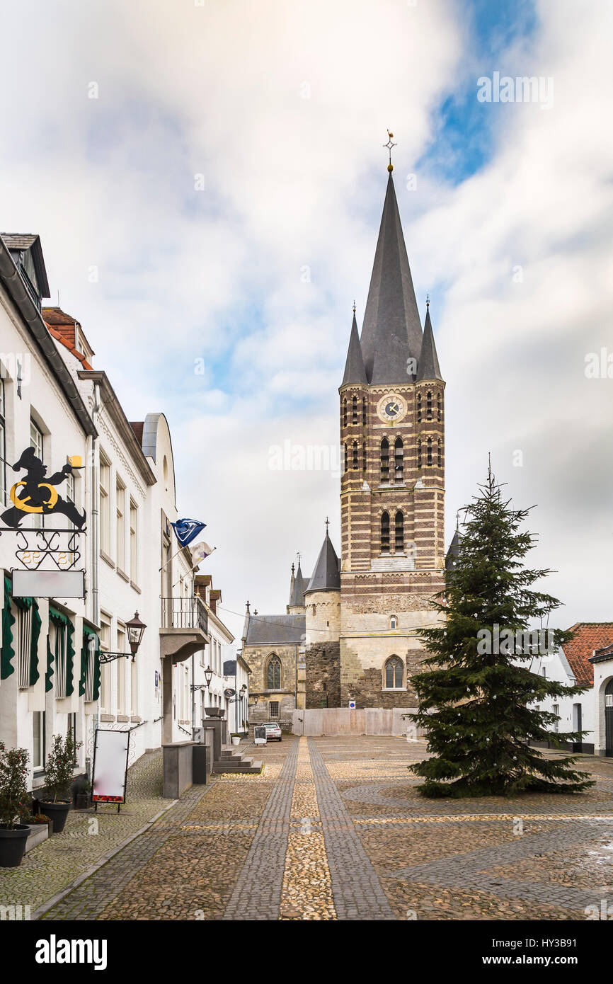 Square in front of a church in the historic city center of Thorn in Limburg, the Netherlands. Known for its white houses Stock Photo