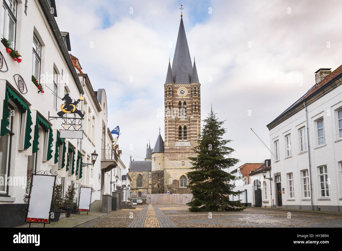 Square in front of a church in the historic city center of Thorn in Limburg, the Netherlands. Known for its white houses Stock Photo