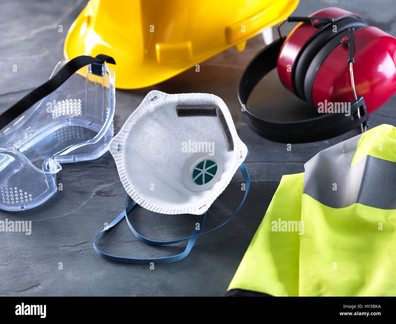 Dust mask, goggles, hard hat, high visibility vest and ear defenders
