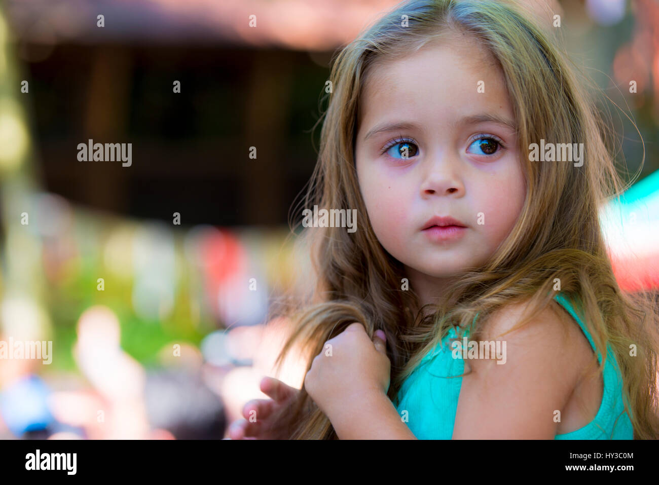 little girl looking back for something or someone Stock Photo