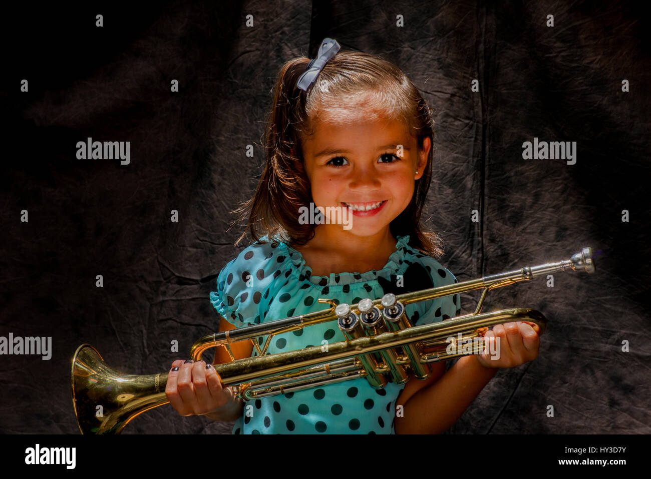 young girl with musical instrument horn Stock Photo