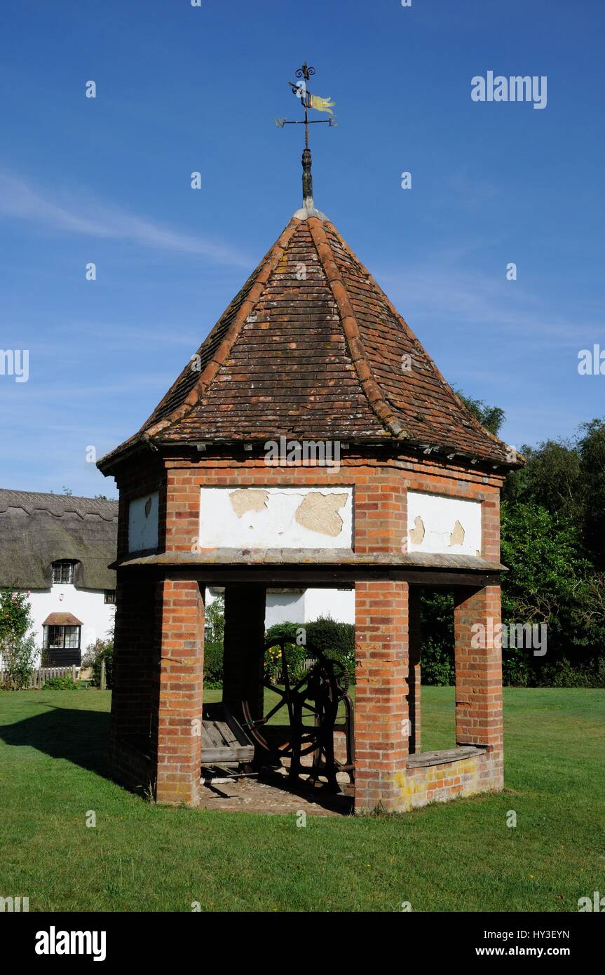 Well House. Ardeley, Hertfordshire. Built in the centre of the green.  A hexagonal structure built of brick and solid timbers, with a tiled roof toppe Stock Photo