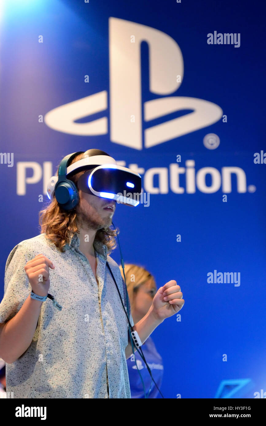 BARCELONA - JUN 16: A man tries the Playstation VR (Virtual Reality) glasses at Sonar Festival on June 16, 2016 in Barcelona, Spain. Stock Photo