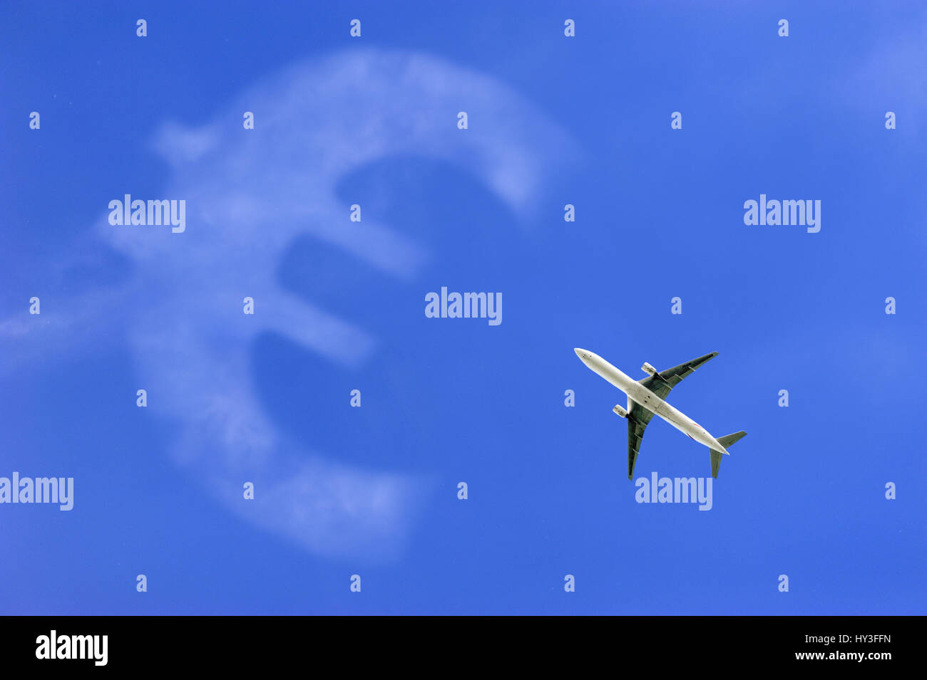 Airplane in the sky and eurosign, symbolic photo aerial transfer tax, Flugzeug am Himmel und Eurozeichen, Symbolfoto Luftverkehrssteuer Stock Photo