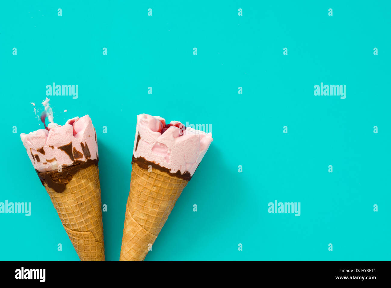 Strawberry ice cream cone on blue background Stock Photo