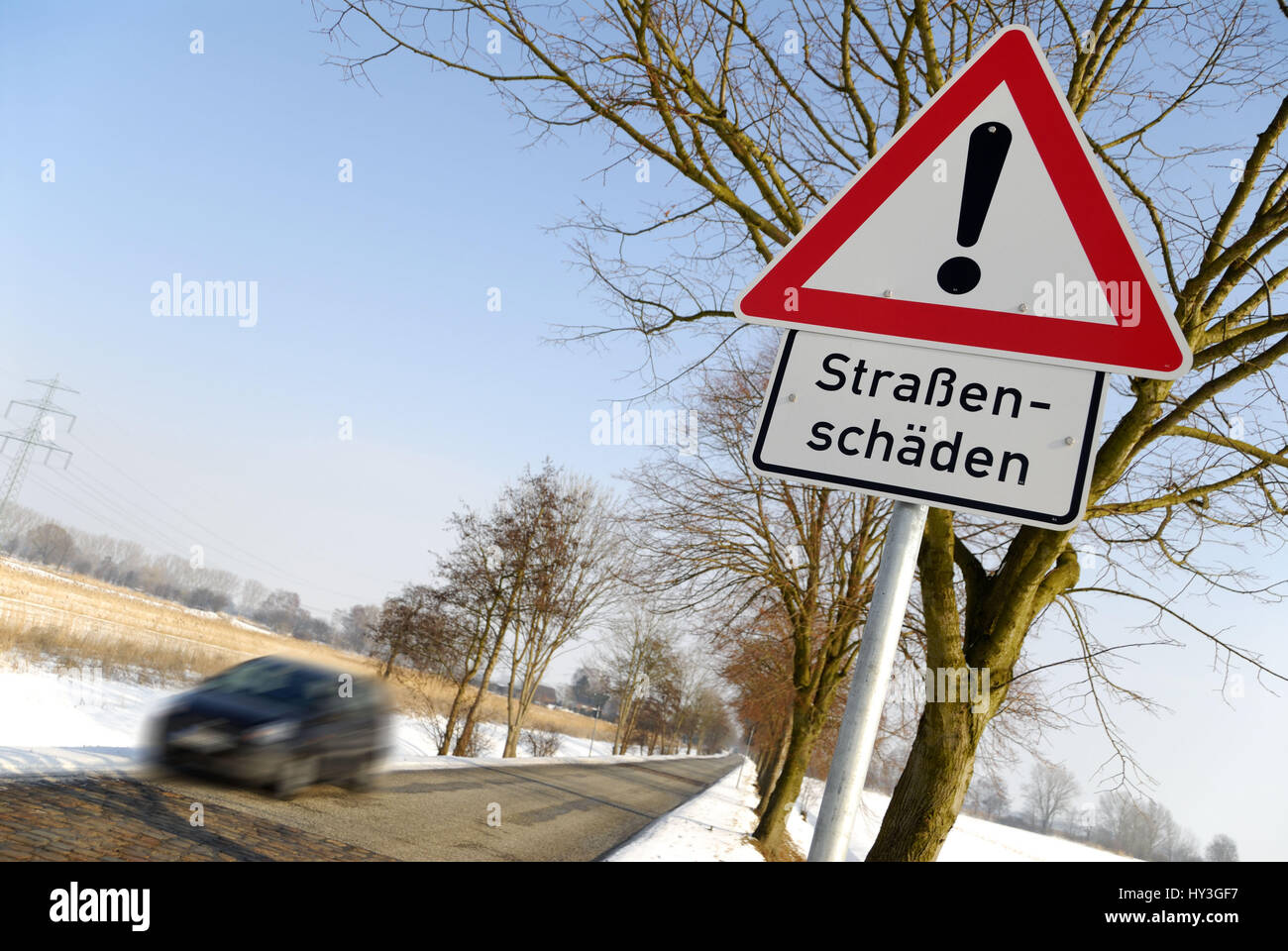 Hard winter: Warning street damages, Harter Winter: Warnschild Straßenschäden Stock Photo