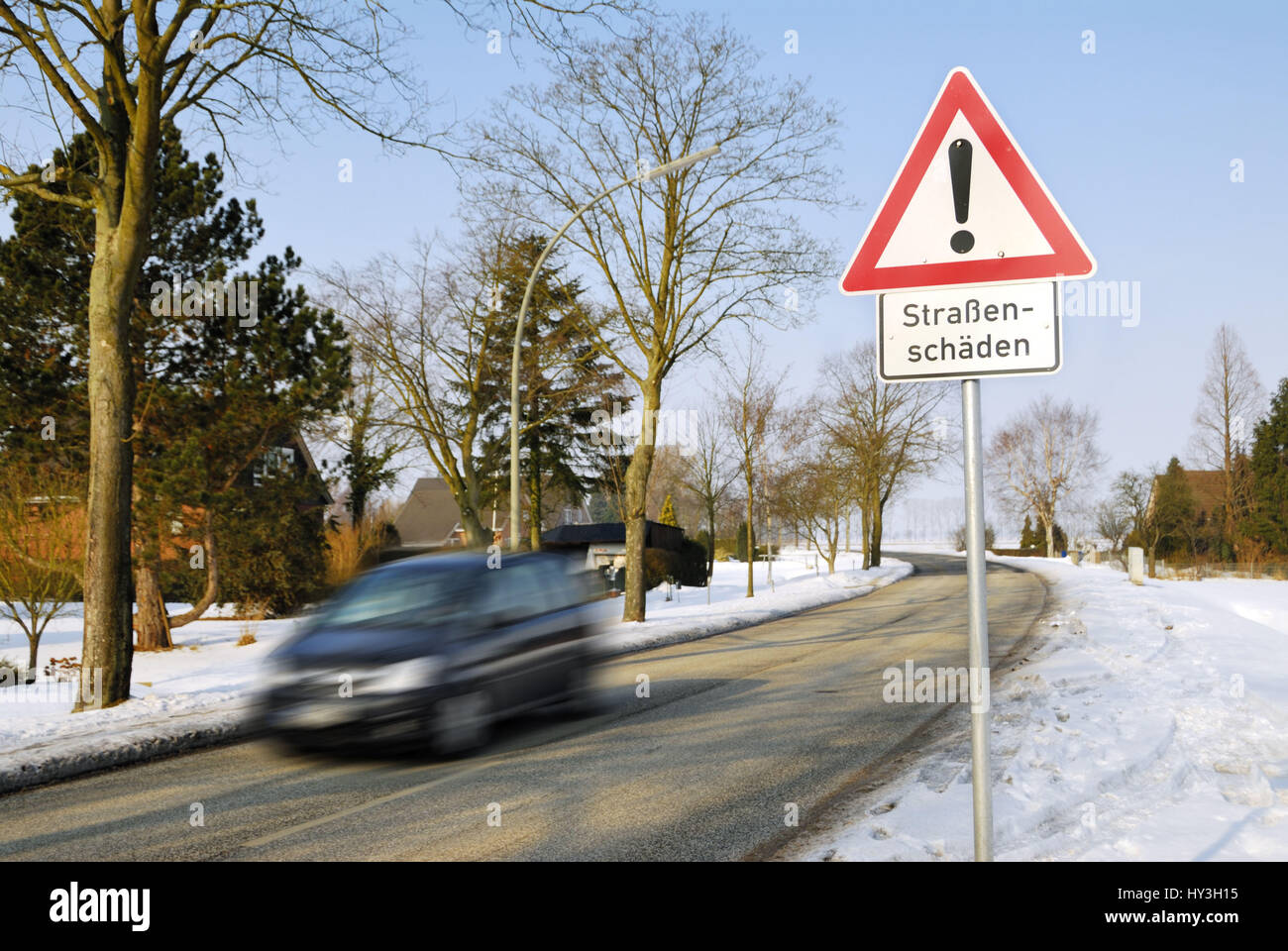 Hard winter: Warning street damages, Harter Winter: Warnschild Straßenschäden Stock Photo