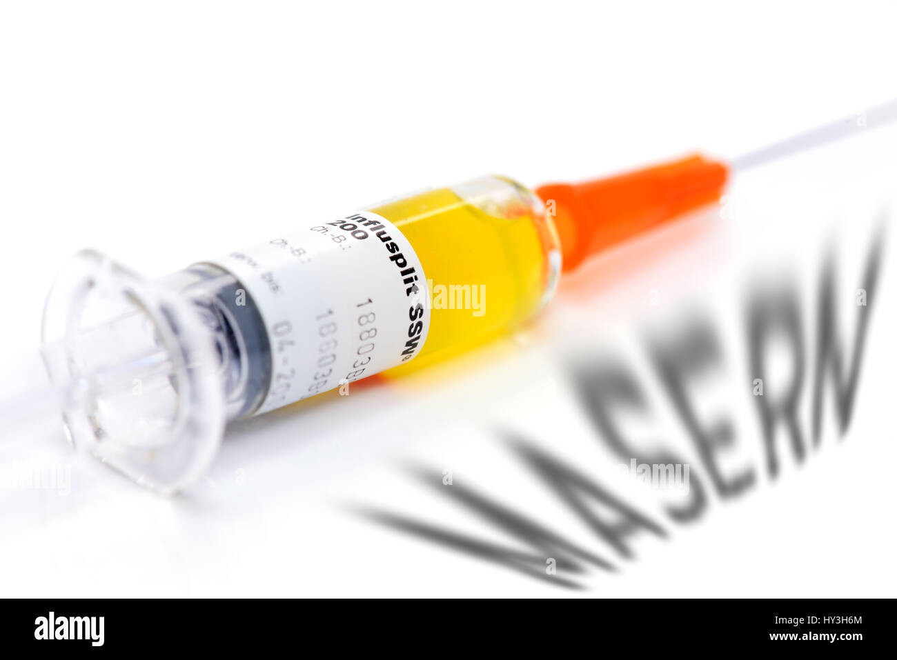 Vaccination syringe and curl stroke, vaccination against measles, Impfspritze und Masern-Schriftzug, Impfung gegen Masern Stock Photo