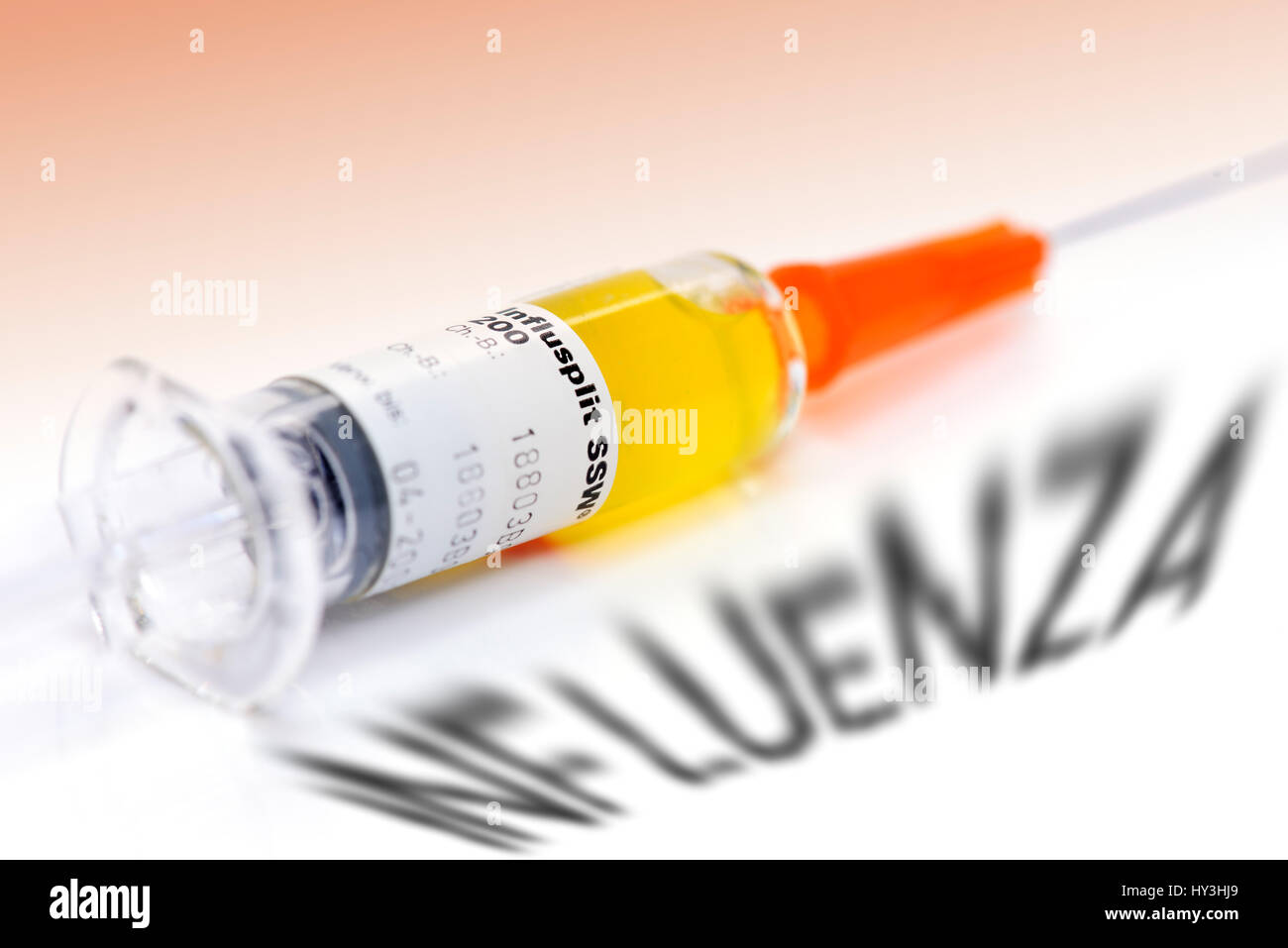 Vaccination syringe and Influenza stroke, vaccination against influenza, Impfspritze und Influenza-Schriftzug, Impfung gegen Grippe Stock Photo