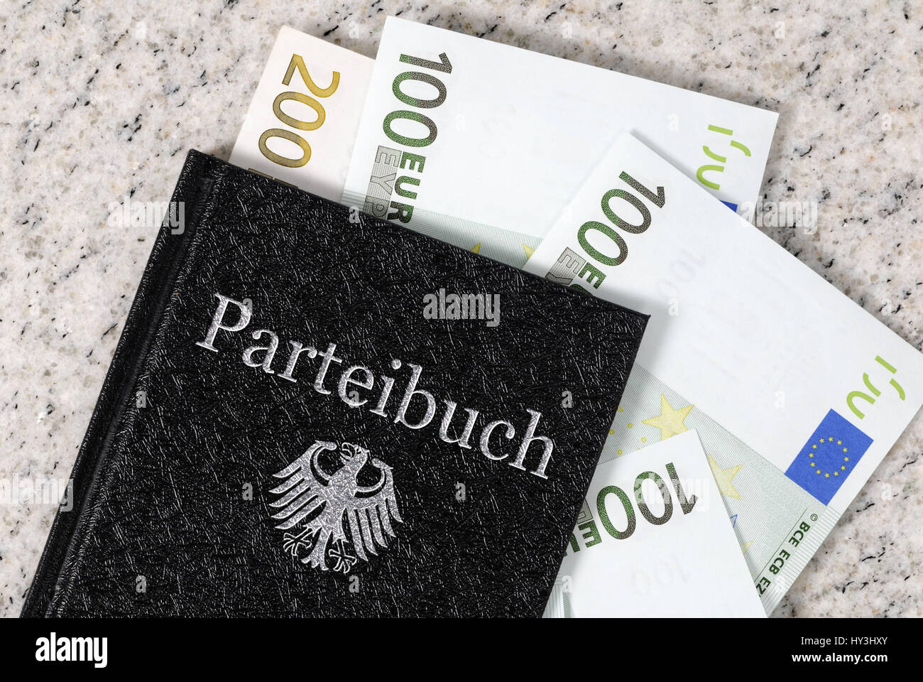 Party card with bank notes, income and additional incomes of politicians, Parteibuch mit Geldscheinen, Einkünfte und Nebeneinkünfte von Politikern Stock Photo