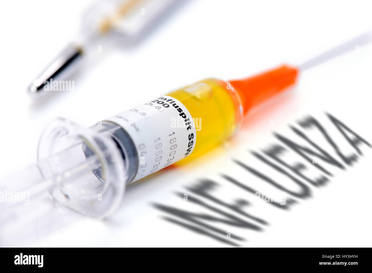 Vaccination syringe and Influenza stroke, vaccination against influenza, Impfspritze und Influenza-Schriftzug, Impfung gegen Grippe Stock Photo