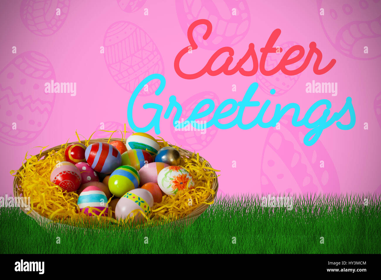 Multi colored easter eggs in wicker basket against pink background ...