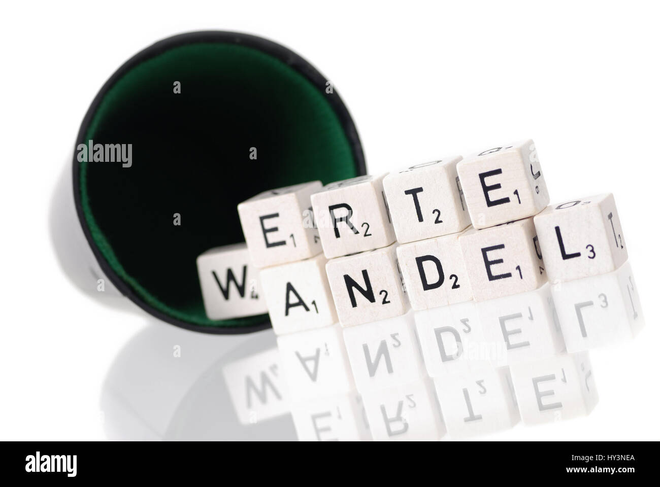 Dice cup with letter cube, stroke value change, Würfelbecher mit Buchstabenwürfel, Schriftzug Wertewandel Stock Photo