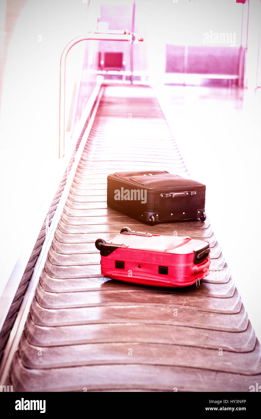 High angle view of suitcase on baggage claim at airport Stock Photo