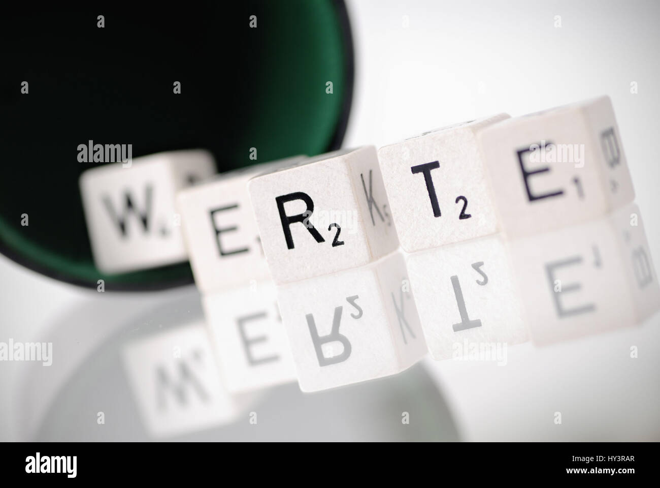 Dice cup with letter cube, stroke values, Würfelbecher mit Buchstabenwürfel, Schriftzug Werte Stock Photo