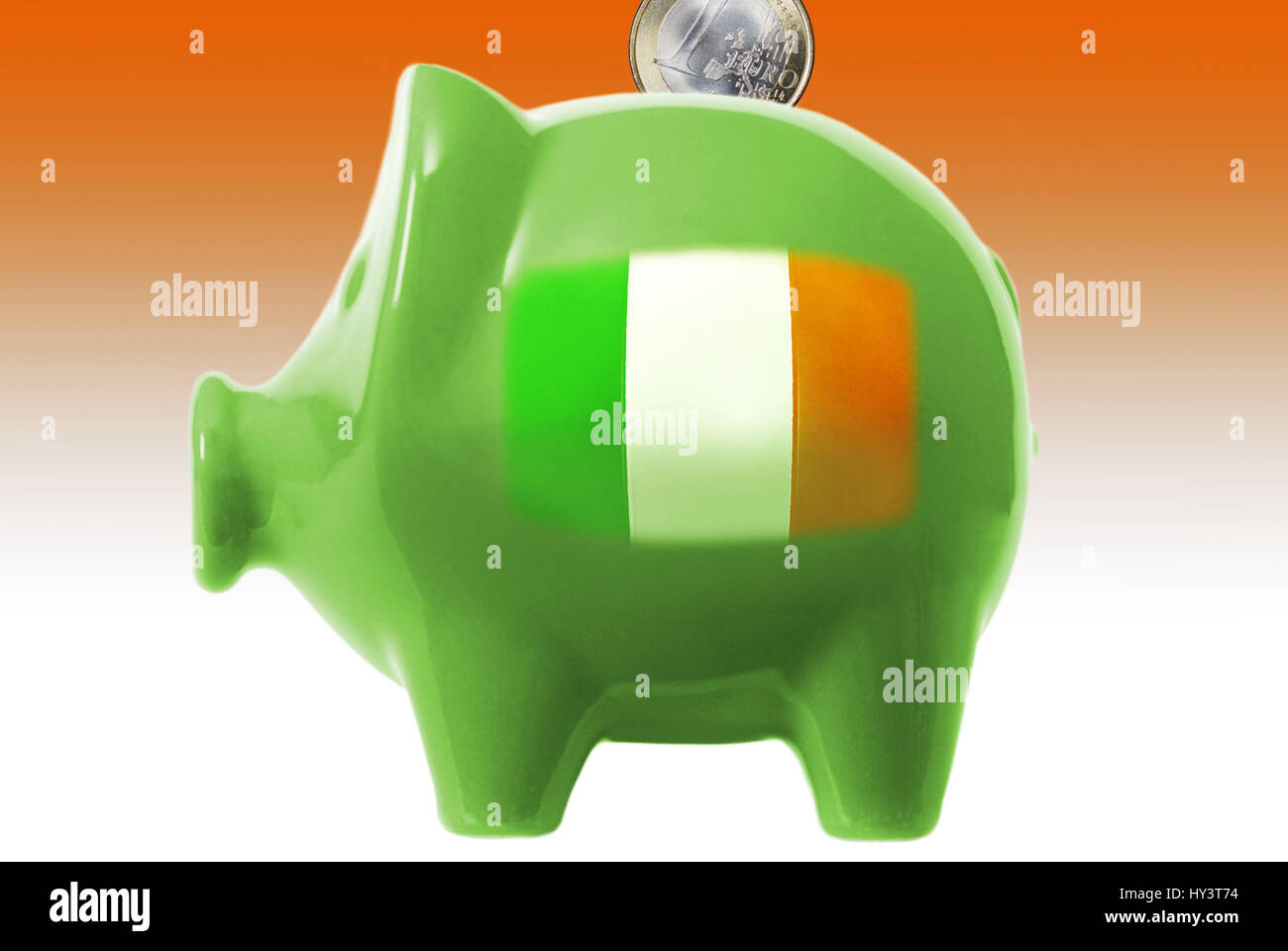 Piggy bank with the flag of Ireland, Sparschwein mit der Flagge von Irland Stock Photo
