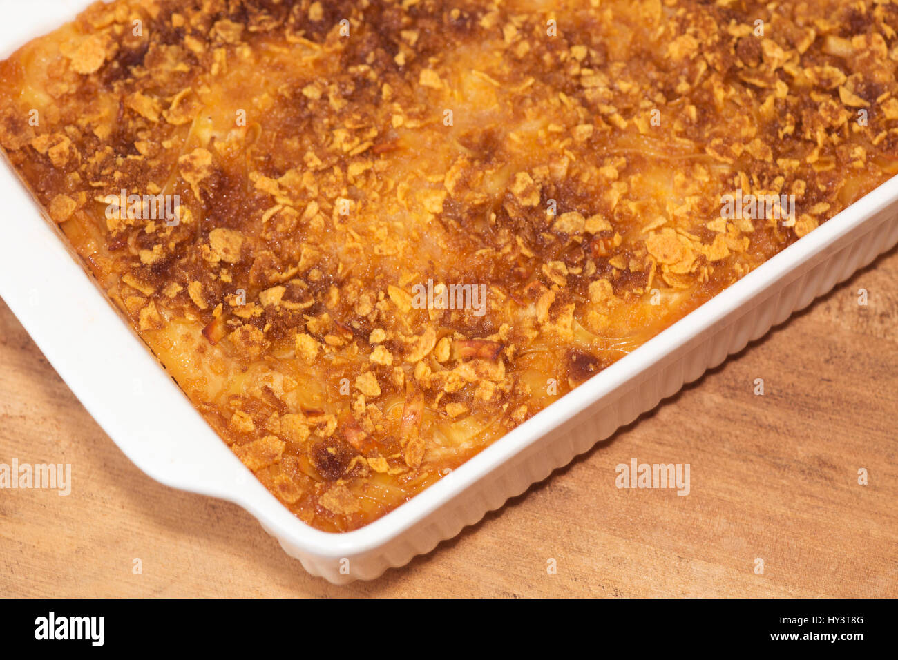 Kugel, a homemade baked sweet casserole made from egg noodles, with cereal and brown sugar sprinkled on top Stock Photo