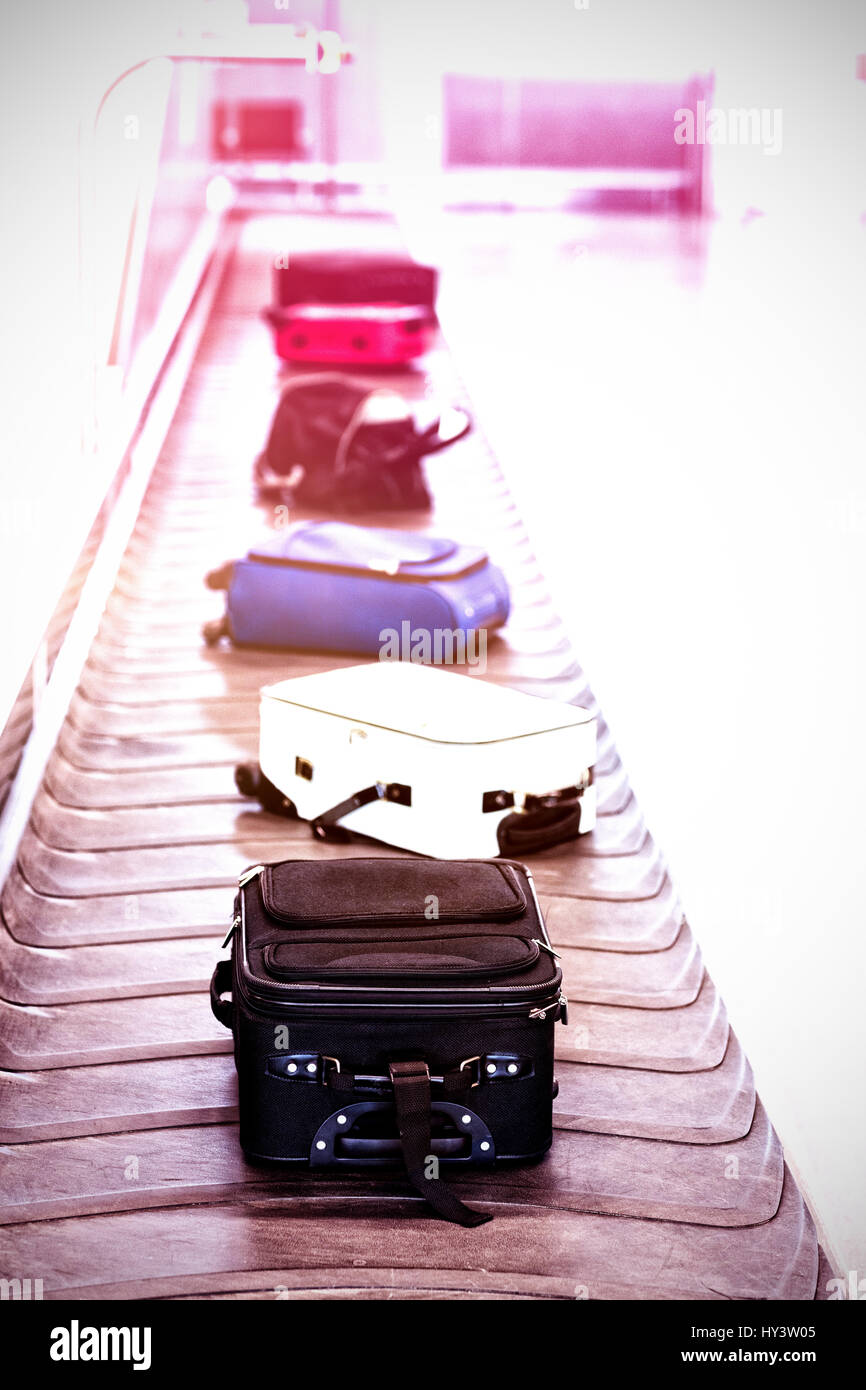 High angle view of luggage on baggage claim at airport Stock Photo