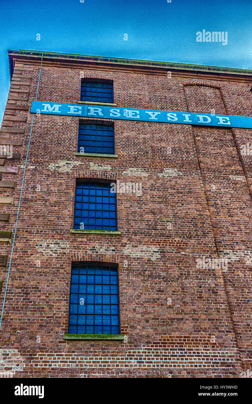 One of the buildings on the Albert Dock in Liverpool with Merseyside wrote across the Building Stock Photo