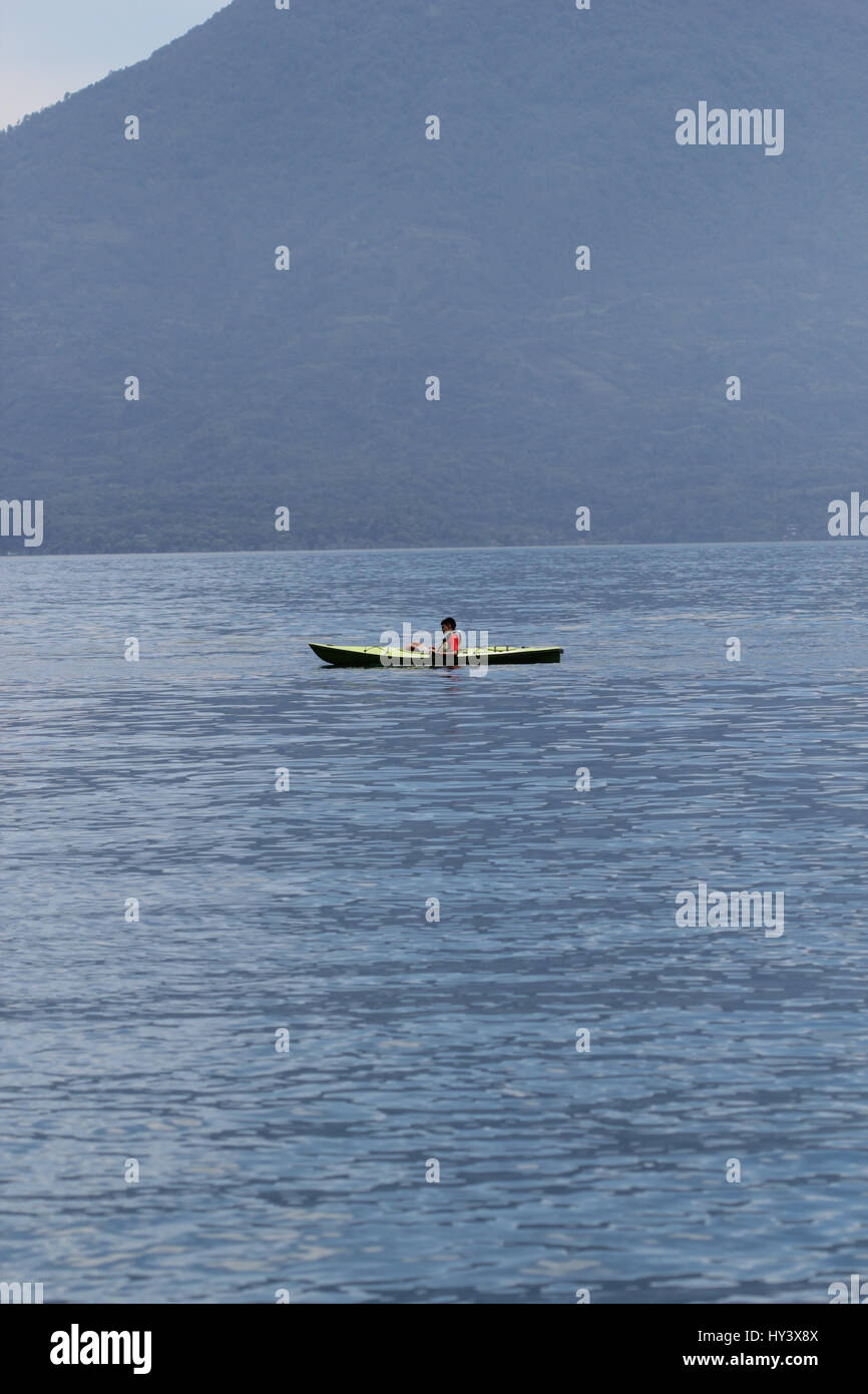 People are kayaking with kayak in lake Atitlan Guatemala with beautiful