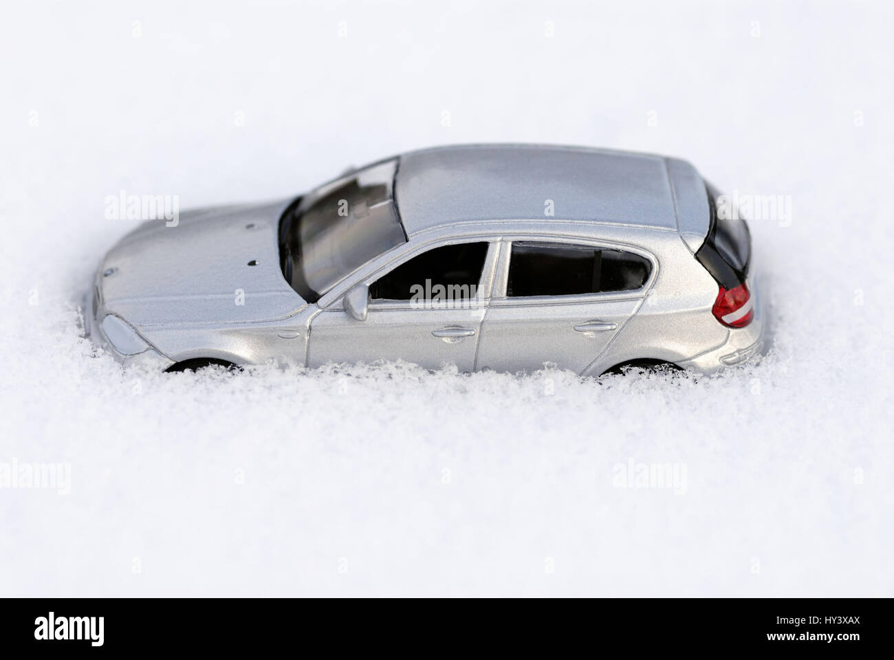 Miniature car in the snow submerged, Miniaturauto im Schnee versunken Stock Photo