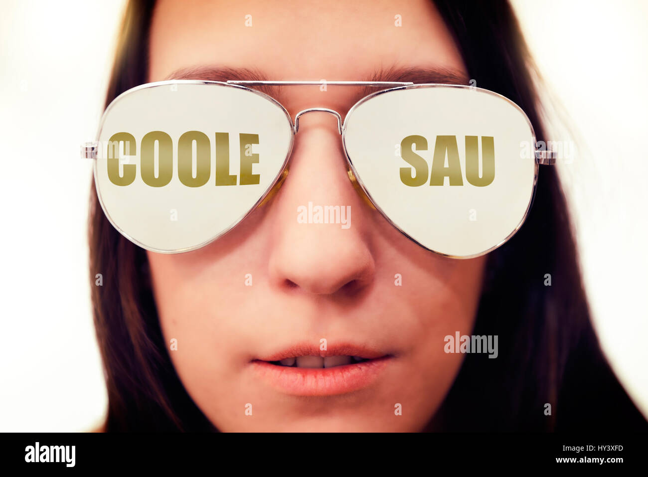 Woman with reflecting glasses, label cool sow, Frau mit Spiegelbrille, Aufschrift Coole Sau Stock Photo
