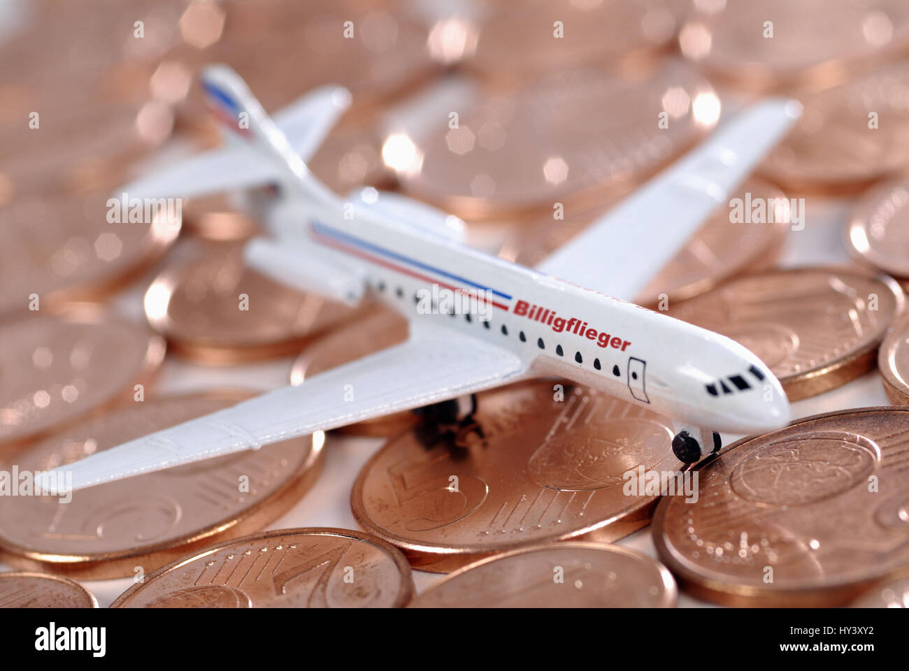 Miniature airplane on cent coins, cheap Airlines, Miniaturflugzeug auf Cent-Muenzen, Billig-Airlines Stock Photo