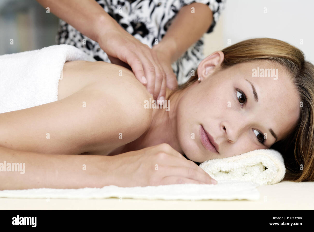 Young woman with massage treatment, Junge Frau bei Massagebehandlung Stock Photo