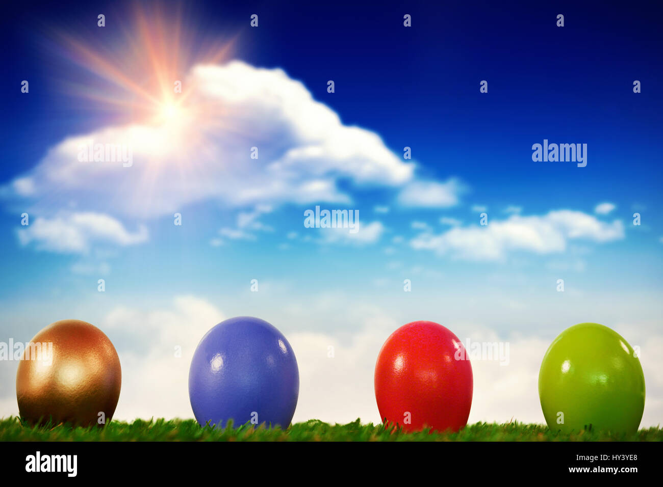 Grass against bright blue sky with clouds Stock Photo - Alamy
