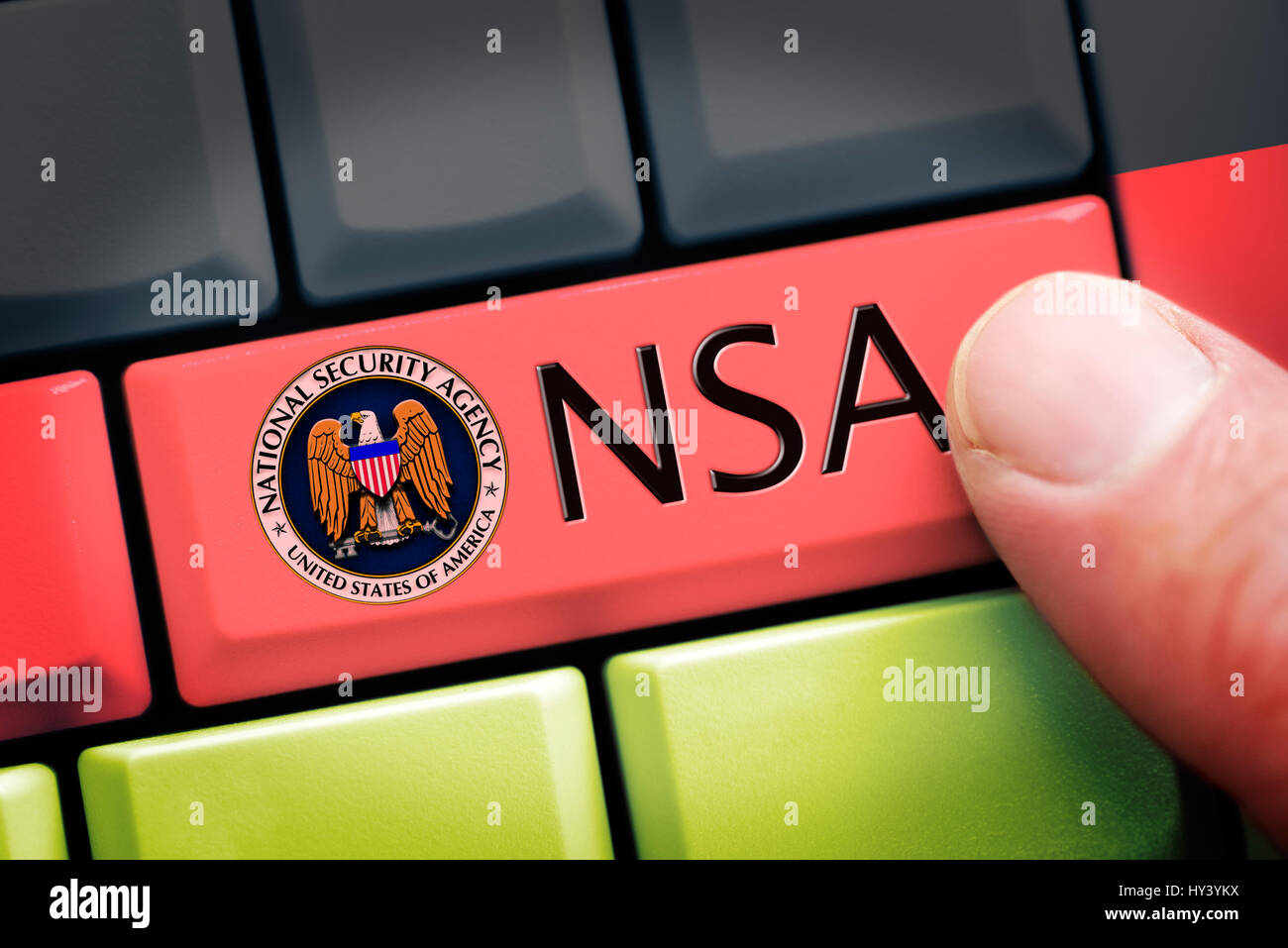 Finger on computer key with NSA sign on German national colours, symbolic photo Federal Intelligence Service scandal, Finger auf Computertaste mit NSA Stock Photo